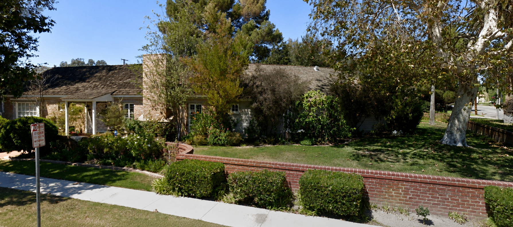Chestnut Residence — existing single-story home with brick and shingle facade before remodel